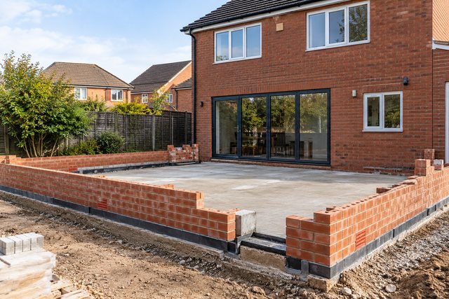 Example image: the brickwork stage of a rear extension