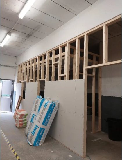 New stud partitions framed out in a commercial unit, ready for boarding