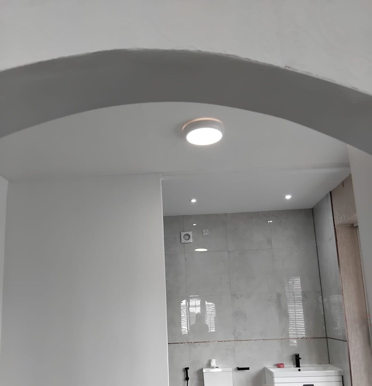 Through the new arch into the finished bathroom